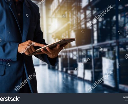 stock-photo-businessman-manager-using-tablet-check-and-control-for-workers-with-modern-trade-warehouse-1150798982